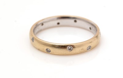 Lot 466 - A diamond and 18ct yellow gold eternity ring