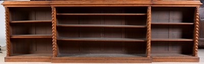 Lot 1091 - A large late Victorian walnut breakfront open bookcase