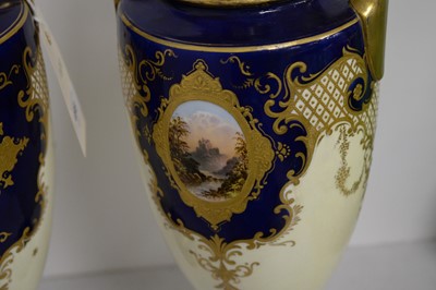 Lot 495 - A pair of Coalport twin handled urn vases