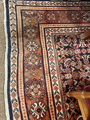 Lot 91 - An Eastern bordered carpet.