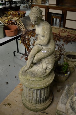 Lot 581 - A 20th C stone composite garden ornament of a nude lady.