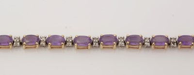 Lot 476 - A diamond and amethyst line bracelet