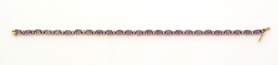 Lot 476 - A diamond and amethyst line bracelet