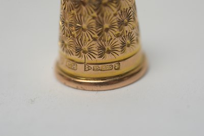 Lot 304 - Two 15ct yellow gold thimbles.