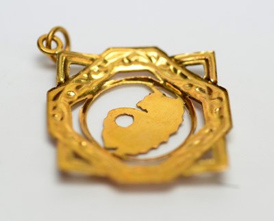 Lot 131 - Four yellow metal pendants