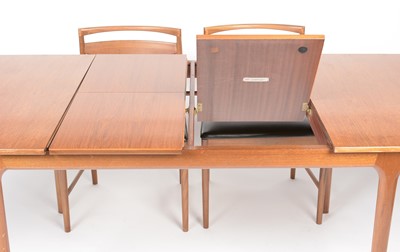Lot 385 - A. H. McIntosh & Co. Ltd, Kirkcaldy: a mid Century teak extending dining table and six chairs.