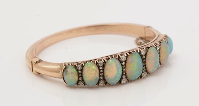 Lot 483 - A Victorian opal and diamond bangle