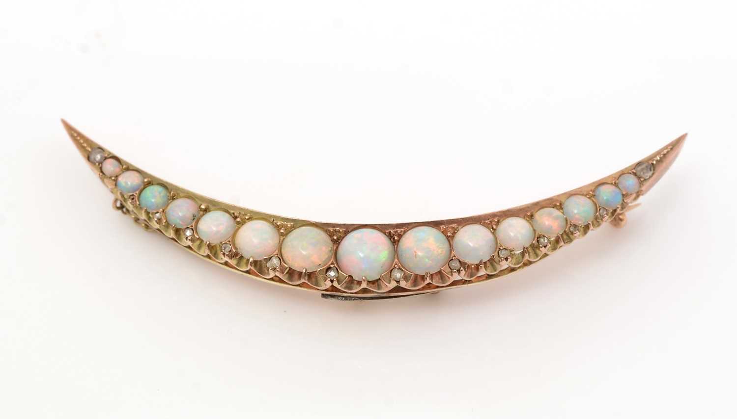 Lot 485 - A Victorian opal and diamond crescent brooch