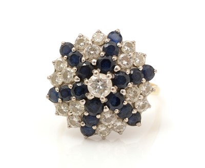 Lot 489 - A sapphire and diamond cluster ring