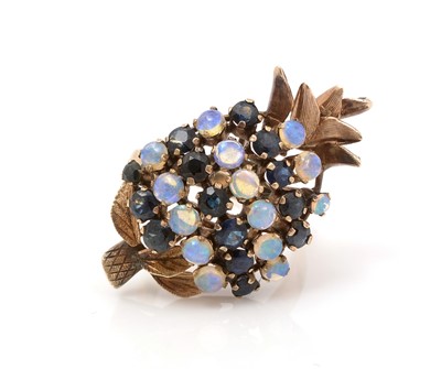 Lot 491 - An opal and sapphire pineapple pattern ring