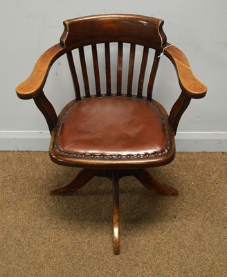 Lot 19 - An early 20th Century stained beech swivel office armchair