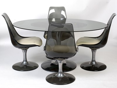 Lot 31 - Chromcraft USA; a 1970's smoked glass tulip table, with four swivel dining chairs.
