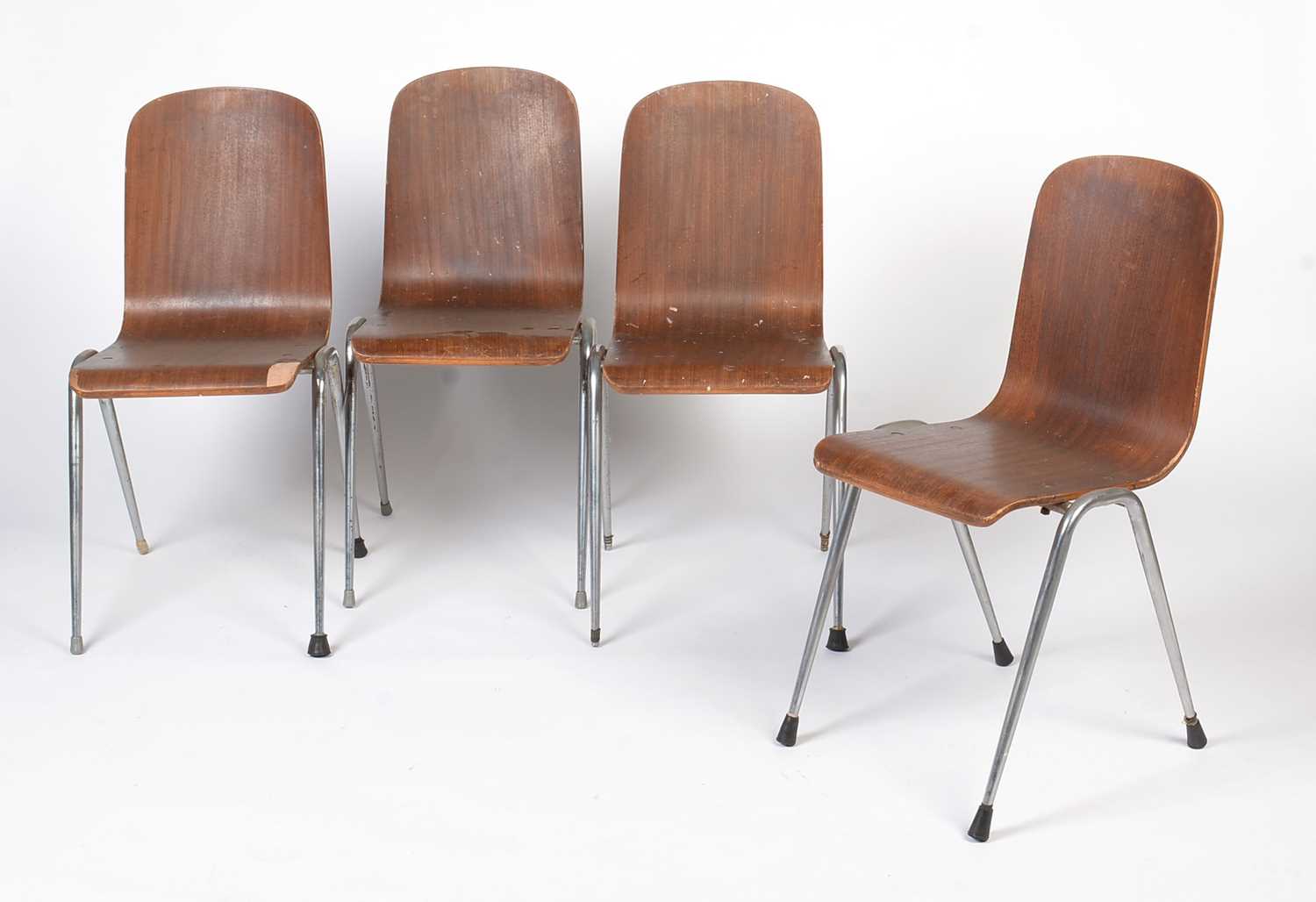 Lot 366 - A set of four vintage bent plywood and chrome metal stacking chairs