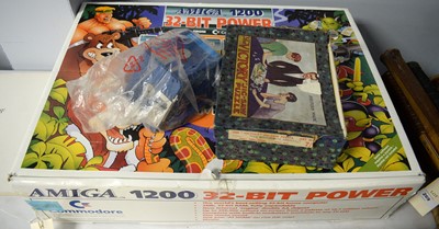 Lot 266 - An Amiga computer; selection of floppy discs; and a jigsaw puzzle.