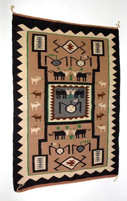 Lot 906 - Annie Begay, Navajo, Native American: a Storm pattern rug