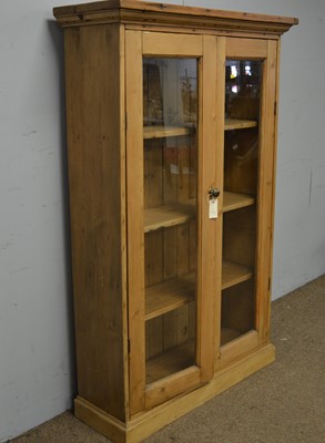 Lot 82 - A 20th Century stripped pine bookcase.