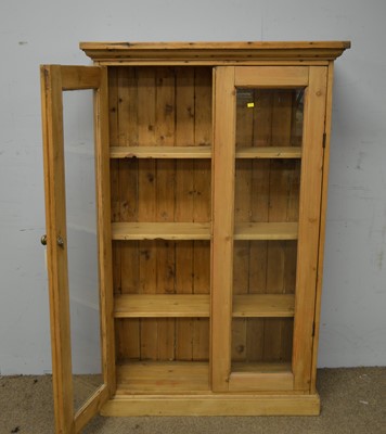 Lot 82 - A 20th Century stripped pine bookcase.