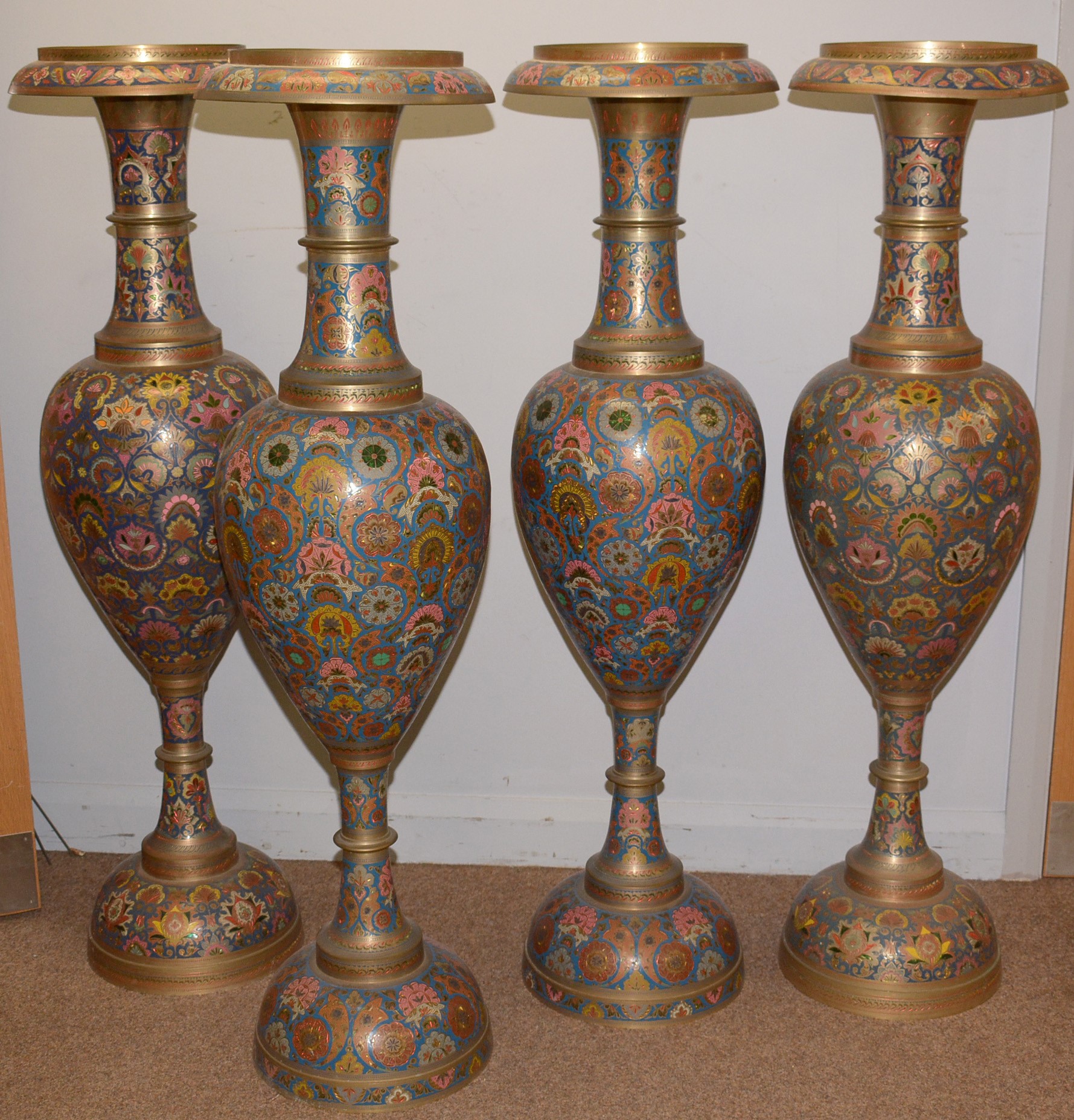 Lot 11 A selection of four Indian enamelled brass