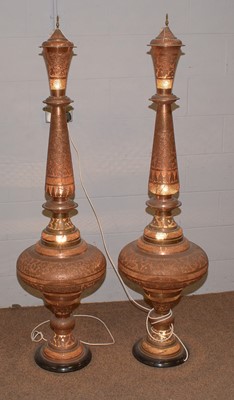 Lot 42 - A pair of Indian pierced coppered brass floor standing lamps