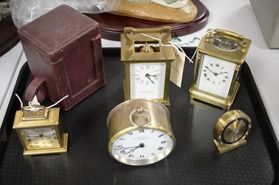 Lot 429 - A selection of Victorian and later brass-cased clocks.