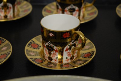 Lot 436 - A set of Royal Crown Derby Imari pattern coffee cups and saucers