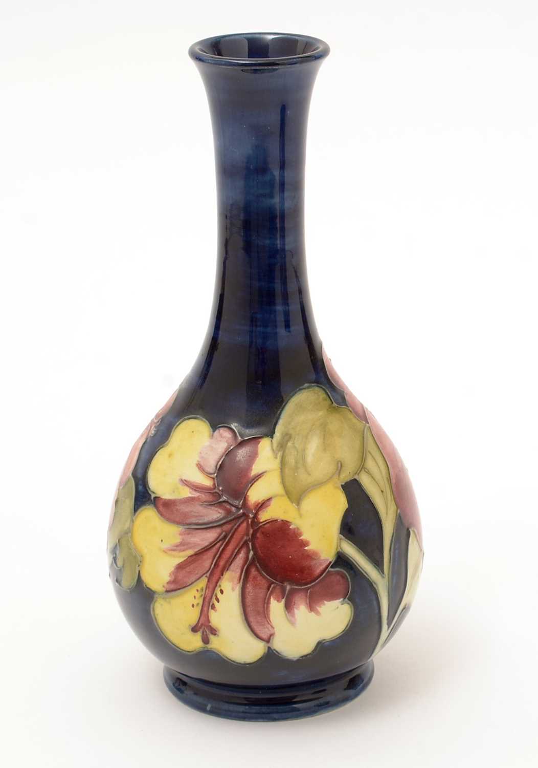 Lot 455 - A Moorcroft Hibiscus pattern bottle vase.