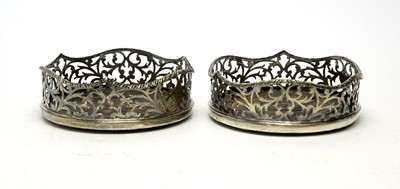 Lot 559 - A pair of early Victorian silver mounted coasters