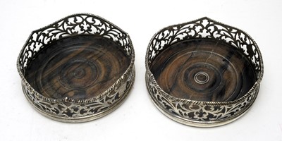 Lot 559 - A pair of early Victorian silver mounted coasters