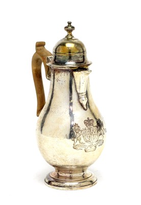 Lot 561 - A Queen Anne silver hot water jug, by John Read