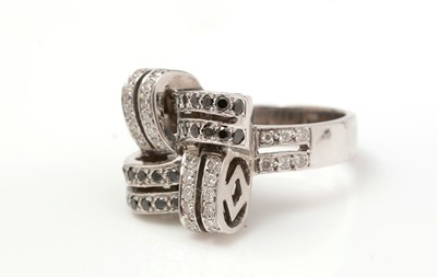Lot 501 - A diamond and black diamond bow pattern ring