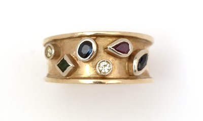 Lot 502 - A diamond, sapphire, ruby and emerald ring