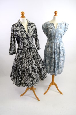 Lot 1241 - Two 1950s printed cotton day dresses