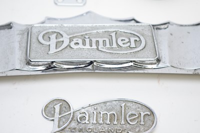 Lot 820 - A selection of Daimler cast metal car badges.