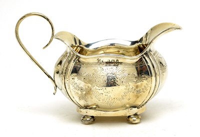 Lot 549 - An Edwardian silver three piece tea service, by Joseph Gloster Ltd