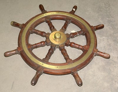 Lot 982 - An early 20th Century brass-mounted ship's wheel.