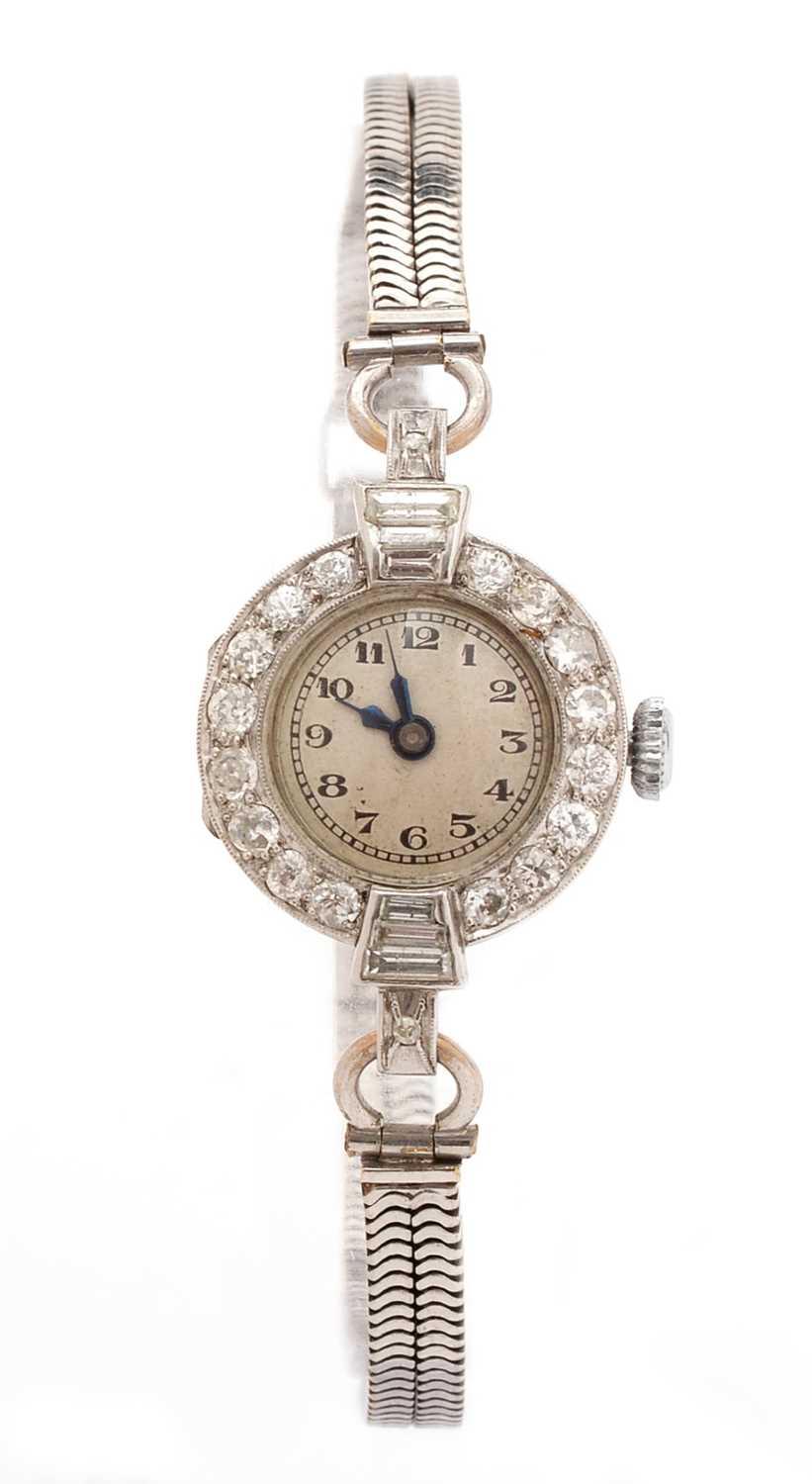 Lot 384 - An early 20th Century platinum cased cocktail watch