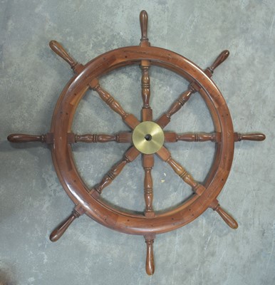 Lot 985 - A 20th Century turned mahogany eight-spoke ship's wheel.