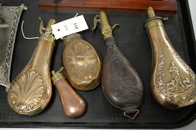 Lot 411 - A selection of copper, brass and leather powder flasks and other items.
