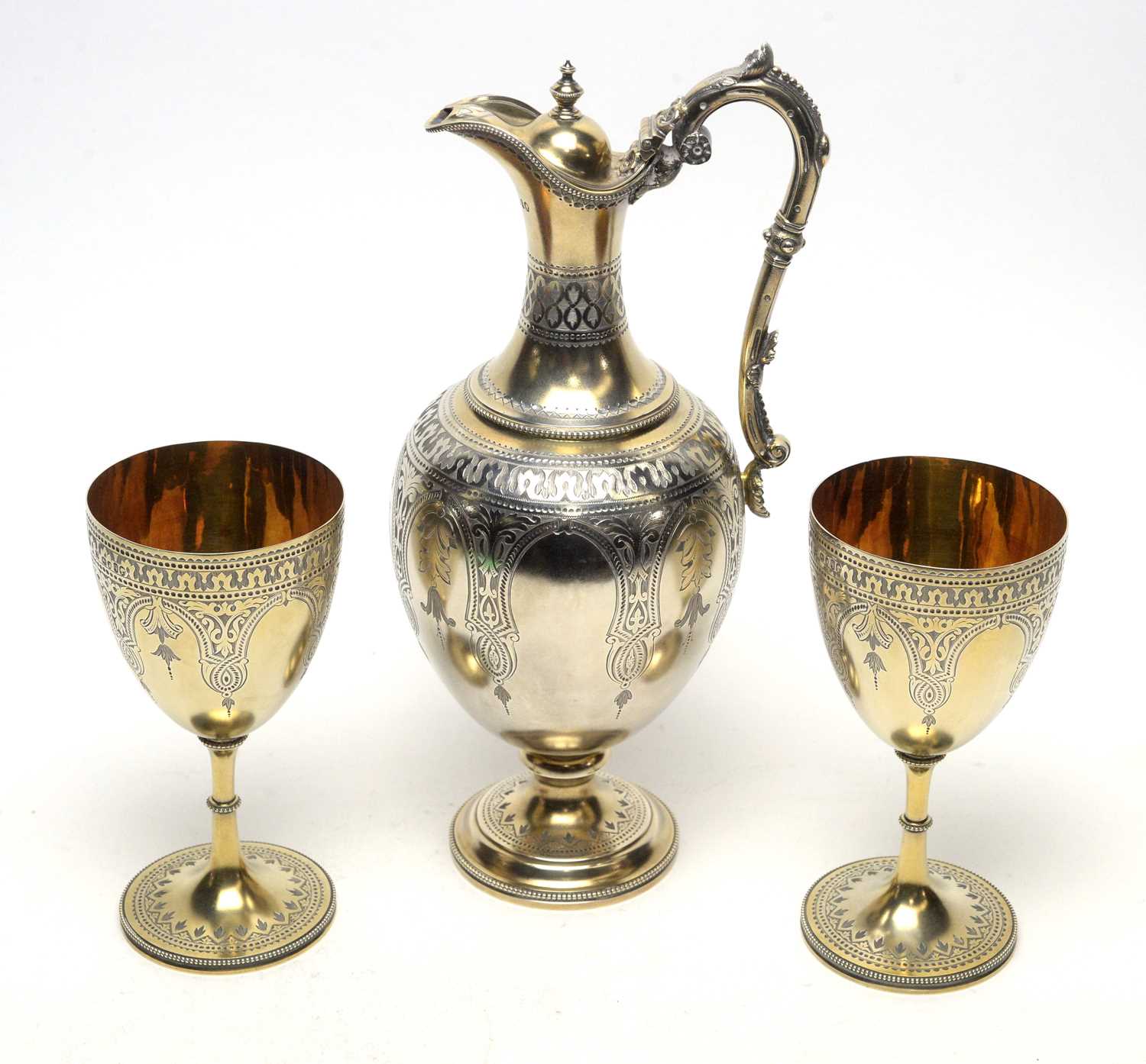 594 - A fine Victorian silver claret jug and two matching chalices, by Martin Hall & Co,