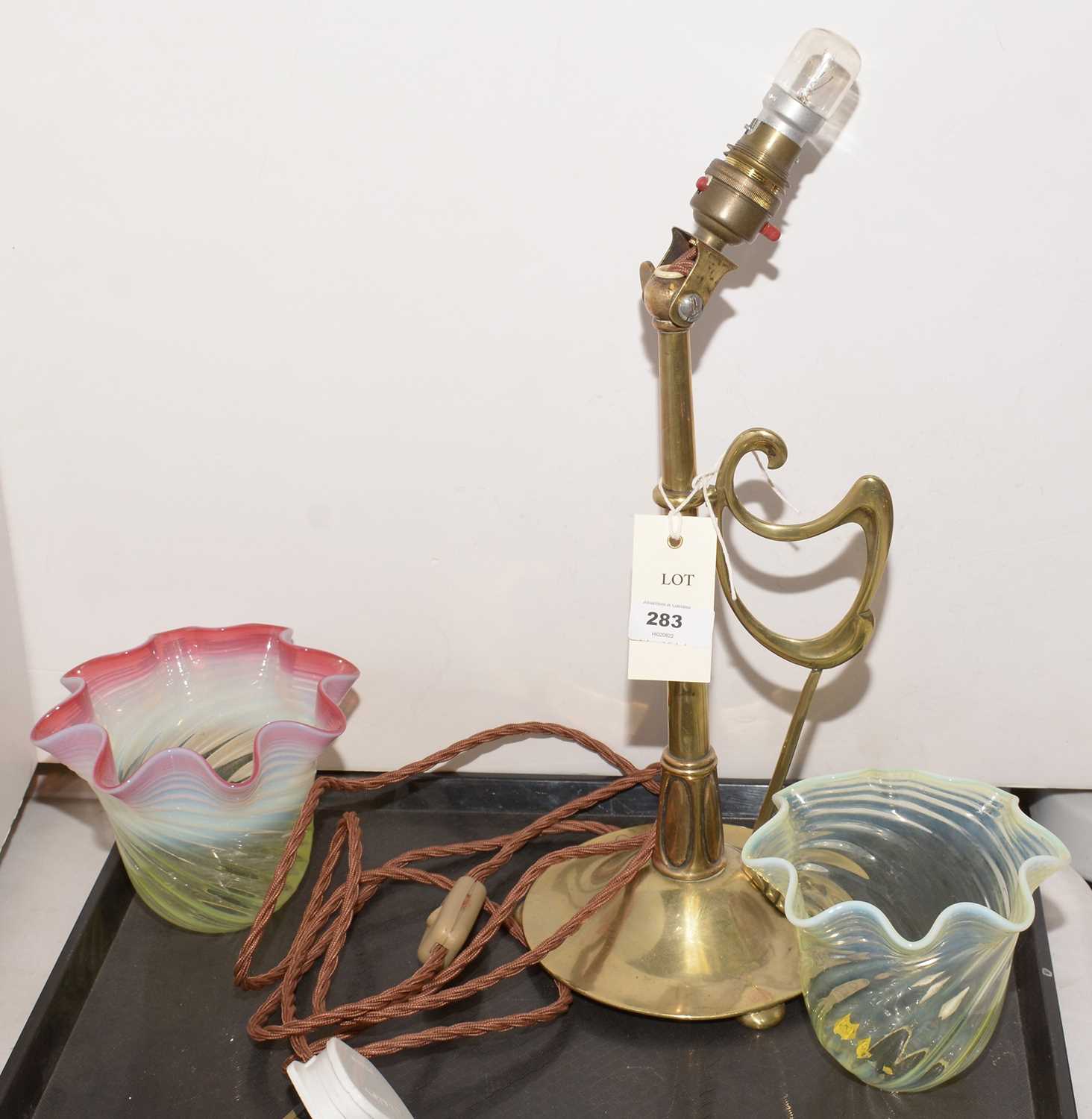 Lot 283 - Art Deco table lamp and two vaseline glass shades.