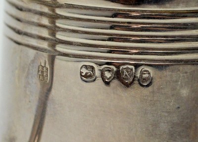 Lot 597 - A set of twelve Victorian silver miniature tankards