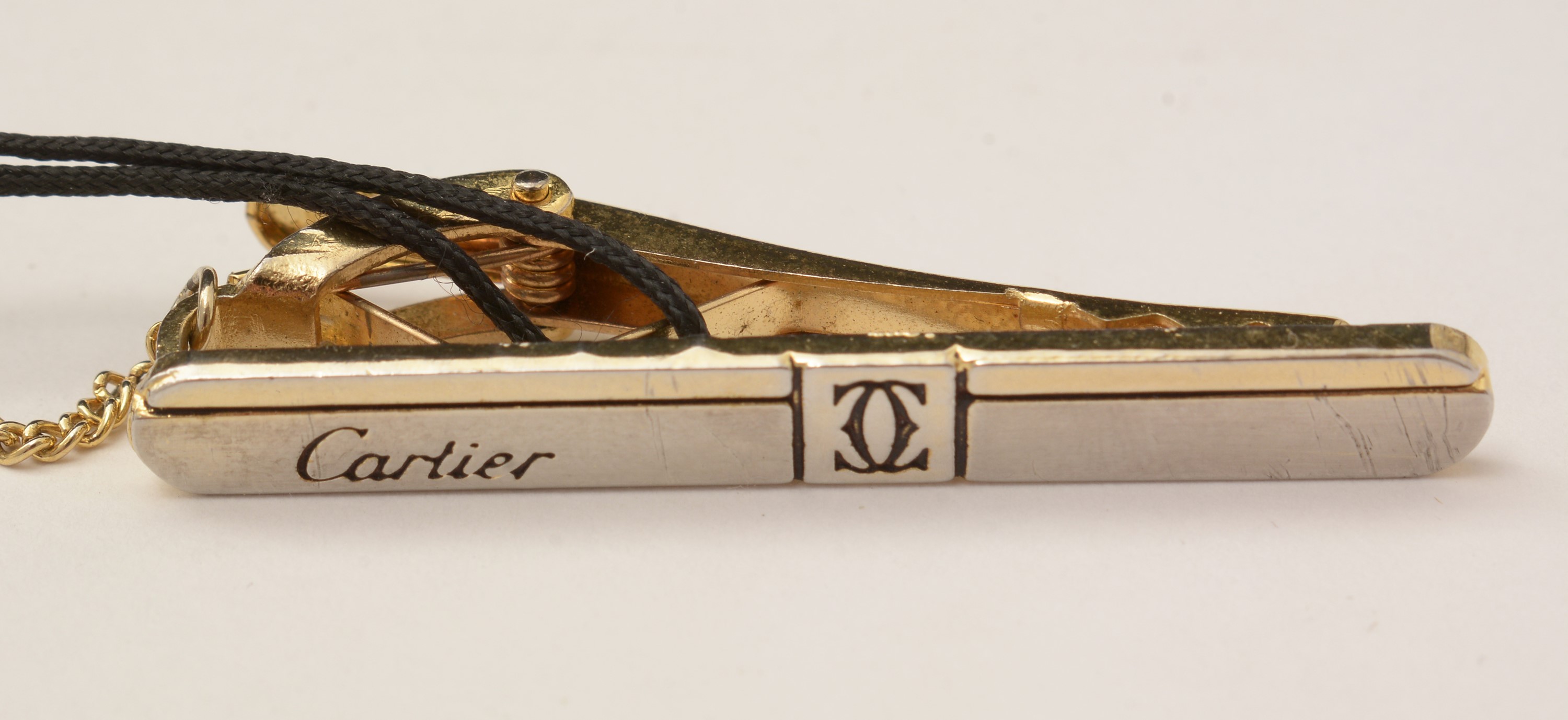 Lot 461 Cartier cufflinks and tie clip