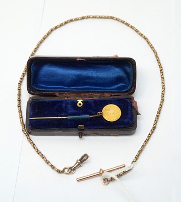 Lot 211 - Gold chain and dollar tie pin.