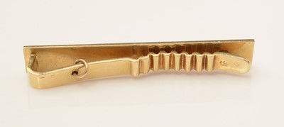 Lot 144 - A diamond set gold tie pin