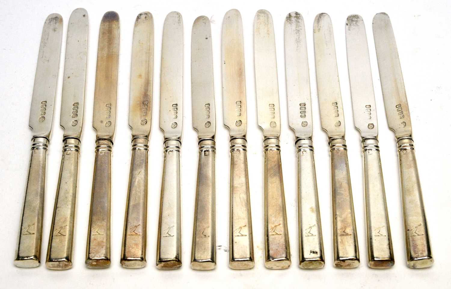 Lot 555 - A set of twelve George III silver tea knives, by Richard Sawyer