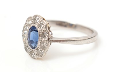 Lot 518 - A sapphire and diamond cluster ring