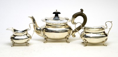 Lot 571 - An Edwardian three piece silver bachelor's tea service, by Holland, Aldwinckle & Slater