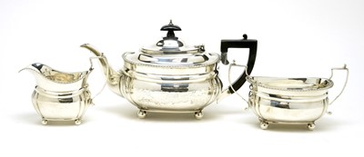 Lot 584 - A George V silver three piece tea service, by Charles Stuart Harris