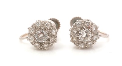 Lot 452 - A pair of diamond cluster earrings