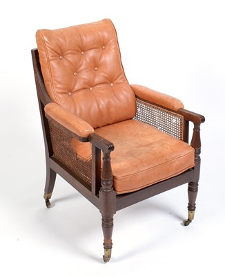 Lot 1056 - A late Georgian mahogany bergere armchair